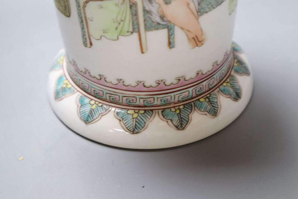 A Chinese cylindrical porcelain brush pot, enamelled with female figures and script, 15cm